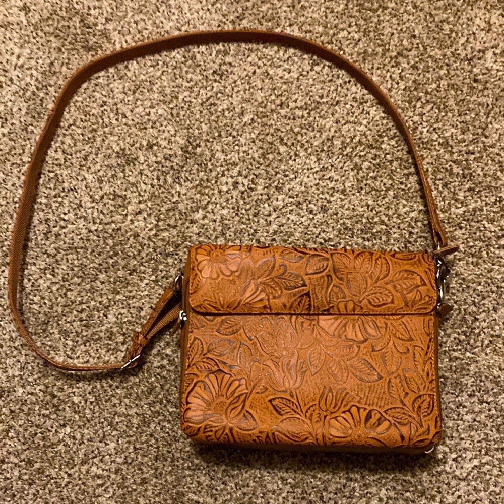 Leather concealed weapon purse. Brand new condition. Removable strap.